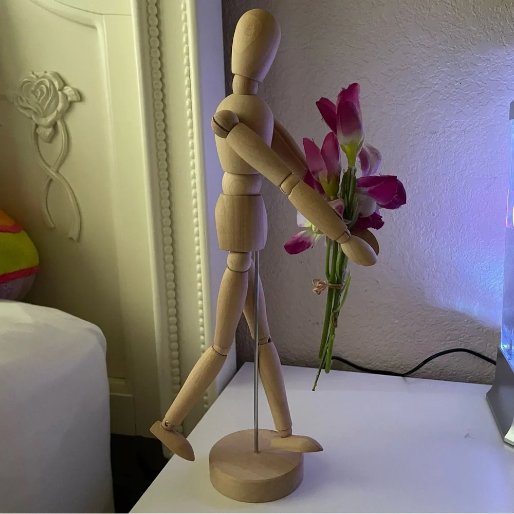 ikea gestalta artist’s wooden figure with flowers